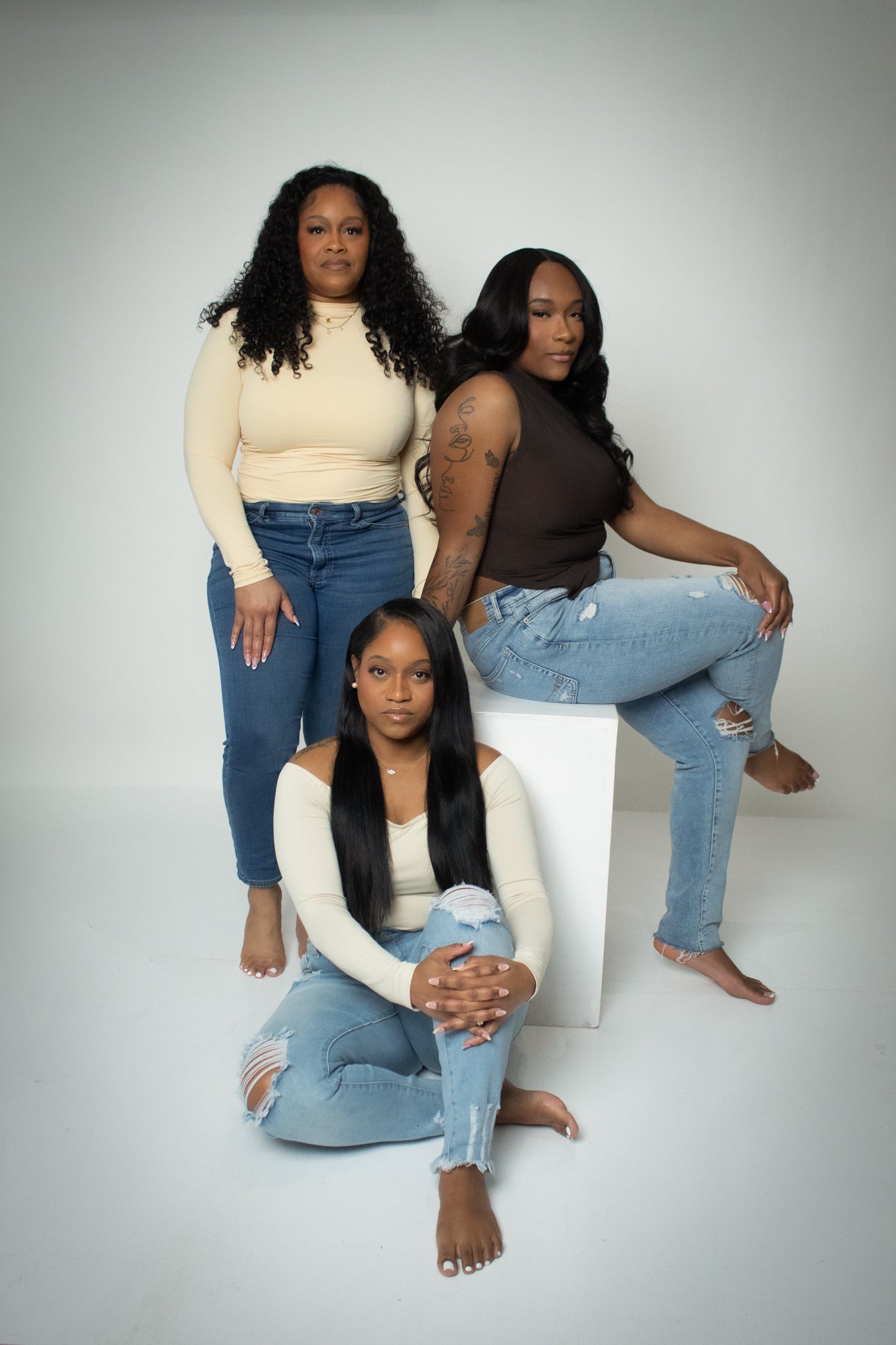 Models wearing Hair She Goes by Adrienne hair extensions